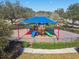 Community playground with shaded play area and slides at 3381 Marshfield Preserve Way, Kissimmee, FL 34746