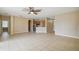 Open living room with kitchen views and tile floors at 3381 Marshfield Preserve Way, Kissimmee, FL 34746