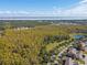 Aerial view of community with conservation area at 3381 Marshfield Preserve Way, Kissimmee, FL 34746