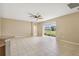 Spacious living room with tile floors and access to patio at 3381 Marshfield Preserve Way, Kissimmee, FL 34746