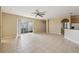 Spacious living room with tile floors and sliding glass doors at 3381 Marshfield Preserve Way, Kissimmee, FL 34746