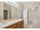 Double vanity bathroom with shower and tub at 3381 Marshfield Preserve Way, Kissimmee, FL 34746