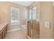 Bathroom with shower, bathtub, and double vanity at 3381 Marshfield Preserve Way, Kissimmee, FL 34746
