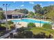 Community pool with lounge chairs and covered patio at 3381 Marshfield Preserve Way, Kissimmee, FL 34746