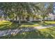 One-story home with a landscaped yard and mature trees at 3381 Marshfield Preserve Way, Kissimmee, FL 34746