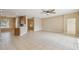 Bright living room with tile floors and sliding glass doors leading to backyard at 3381 Marshfield Preserve Way, Kissimmee, FL 34746