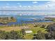 Community features a lakefront with sandy volleyball court at 3381 Marshfield Preserve Way, Kissimmee, FL 34746
