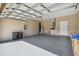 Attached garage with open door and storage at 3381 Marshfield Preserve Way, Kissimmee, FL 34746