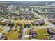 Aerial view of neighborhood with lake and homes at 3381 Marshfield Preserve Way, Kissimmee, FL 34746