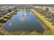 Aerial view of a community lake with a fountain at 3381 Marshfield Preserve Way, Kissimmee, FL 34746