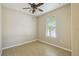Bright bedroom with tile flooring, window, and ceiling fan at 3381 Marshfield Preserve Way, Kissimmee, FL 34746