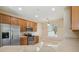 Kitchen features stainless steel appliances and wood cabinets at 3381 Marshfield Preserve Way, Kissimmee, FL 34746