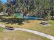 Community tennis court with benches and picnic tables at 3381 Marshfield Preserve Way, Kissimmee, FL 34746