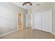 Bright bedroom with double door closet and tile flooring at 3381 Marshfield Preserve Way, Kissimmee, FL 34746