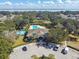 Community pool and clubhouse with parking and water features at 3381 Marshfield Preserve Way, Kissimmee, FL 34746