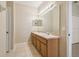 Double vanity bathroom with mirror and lighting at 3381 Marshfield Preserve Way, Kissimmee, FL 34746