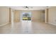 Large living room with tile floors and ceiling fan at 3381 Marshfield Preserve Way, Kissimmee, FL 34746
