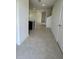 Bright entryway with tile flooring leading to the kitchen and living room at 2893 Fitness St, Clermont, FL 34714