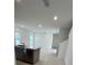 Modern kitchen with island, stainless steel appliances, and ample counter space at 2893 Fitness St, Clermont, FL 34714