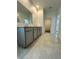 Bathroom with double vanity, gray cabinets, and tile floors at 2893 Fitness St, Clermont, FL 34714