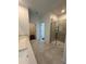 Main bathroom with shower and access to other rooms at 2893 Fitness St, Clermont, FL 34714