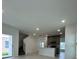 Open living room and kitchen with stairs and view to backyard at 2893 Fitness St, Clermont, FL 34714