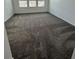 Bright bedroom with gray carpet and large windows at 2893 Fitness St, Clermont, FL 34714