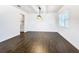 Bright dining room with hardwood floors and a stylish light fixture at 117 W Maple St, Davenport, FL 33837