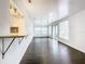 Open living space featuring hardwood floors and access to the kitchen at 117 W Maple St, Davenport, FL 33837