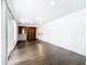 Spacious living room with hardwood floors, sliding doors, and a bar at 117 W Maple St, Davenport, FL 33837