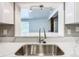 Modern kitchen with stainless steel sink and faucet at 117 W Maple St, Davenport, FL 33837
