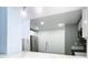 Modern kitchen features white cabinets, stainless steel appliances, and quartz countertops at 117 W Maple St, Davenport, FL 33837