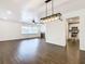 Bright living room with dark hardwood floors, a fireplace, and an open floor plan at 117 W Maple St, Davenport, FL 33837
