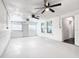 Large bonus room with two ceiling fans and windows for natural light at 117 W Maple St, Davenport, FL 33837