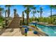 Water features and wooden bridge in the pool area at 4839 Kings Castle Cir, Kissimmee, FL 34746