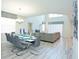 Dining room with gray chairs and a large table at 4839 Kings Castle Cir, Kissimmee, FL 34746