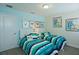 Bright bedroom with two twin beds and colorful bedding at 4839 Kings Castle Cir, Kissimmee, FL 34746