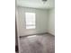 Bright bedroom with neutral walls and carpet at 114 Mandovi St, Davenport, FL 33837