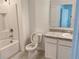 Bathroom with white vanity, toilet, and bathtub at 114 Mandovi St, Davenport, FL 33837