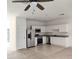 Kitchen with white cabinets, stainless steel appliances, and granite countertops at 114 Mandovi St, Davenport, FL 33837