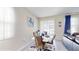 Bright dining area with a modern table and chairs, adjacent to the kitchen at 12456 Turtle Grass Dr, Orlando, FL 32824