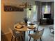 Dining area with a round table and four chairs, ideal for intimate meals at 6402 Parc Corniche Dr # 5208, Orlando, FL 32821