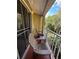 Relaxing balcony overlooking lush greenery and trees at 6402 Parc Corniche Dr # 5208, Orlando, FL 32821