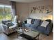 Cozy living room featuring a sofa, armchair, and coffee table, perfect for relaxing at 6402 Parc Corniche Dr # 5208, Orlando, FL 32821