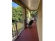 Private balcony with chairs and a view of the backyard at 6402 Parc Corniche Dr # 5208, Orlando, FL 32821