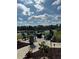 Community fire pit area with seating near a lake at 6402 Parc Corniche Dr # 5208, Orlando, FL 32821