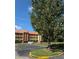 Parking lot with a building in the background at 6402 Parc Corniche Dr # 5208, Orlando, FL 32821