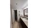 Bathroom with granite countertop vanity and separate toilet area at 6402 Parc Corniche Dr # 5208, Orlando, FL 32821