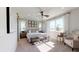 Bright bedroom with a king-size bed, large windows, and an ensuite bathroom at 2103 Riley Ave, Eagle Lake, FL 33839