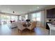 Bright dining room with seating for four and access to the backyard at 2103 Riley Ave, Eagle Lake, FL 33839